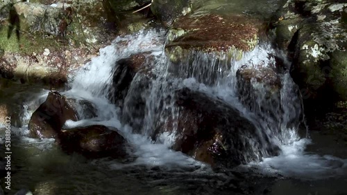 clear river water flowing over the rocks