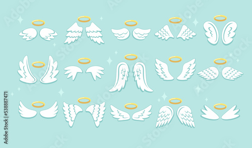 Cartoon angel wings and nimbus set. White feather wings for cupid kid angelic with golden nimbus photo