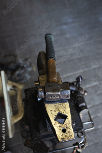 different tools of blacksmith in workshop in forge