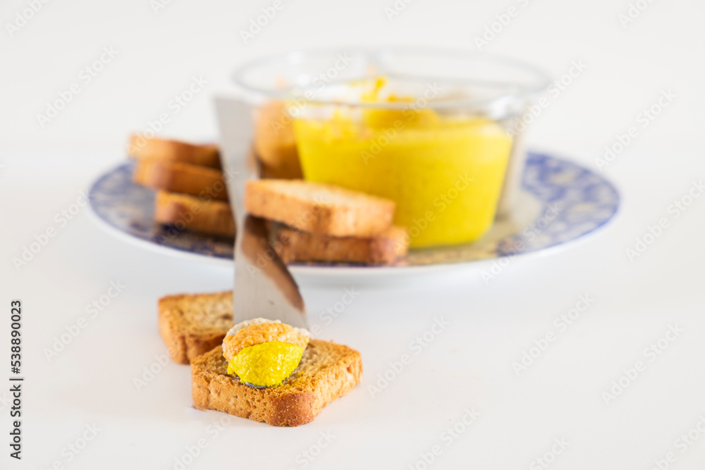 Slice of bread with fresh hummus dip Slice of bread with fresh hummus dip