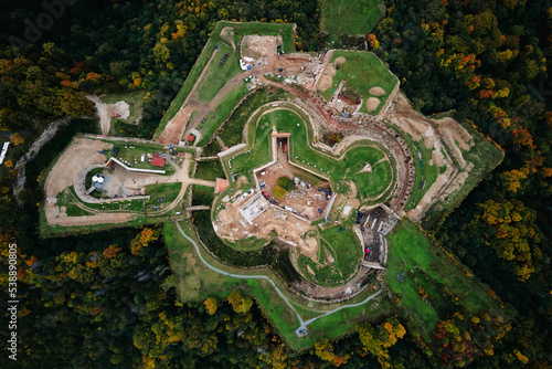 Srebrna Gora fortress and Sudety mountains at autumn season, aerial drone view. Military fort landmark for tourists in Lower Silesia, Poland © Lazy_Bear