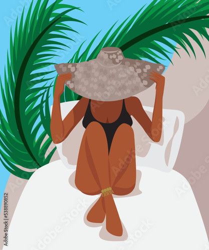 tanned girl on the beach wearing a big hat