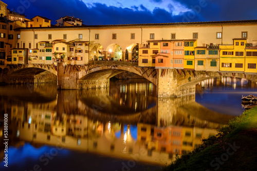 Ponte Vecchio bridge over Arno river at night, Florence, Italy