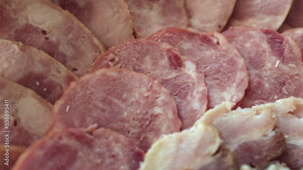 Various meat products on a plate, beef and pork meat, sliced meat Various meat products on a plate, beef and pork meat, sliced meat