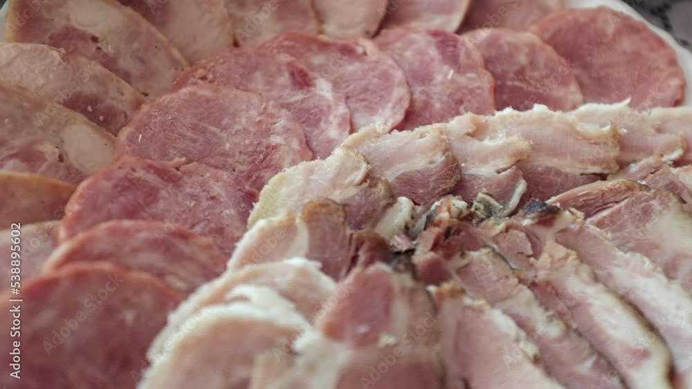 Various meat products on a plate, beef and pork meat, sliced meat Various meat products on a plate, beef and pork meat, sliced meat