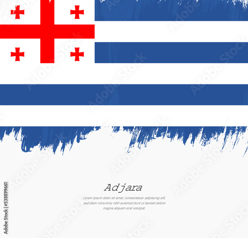 Artistic hand drawn brush stroke flag of Adjara. Creative national flag background