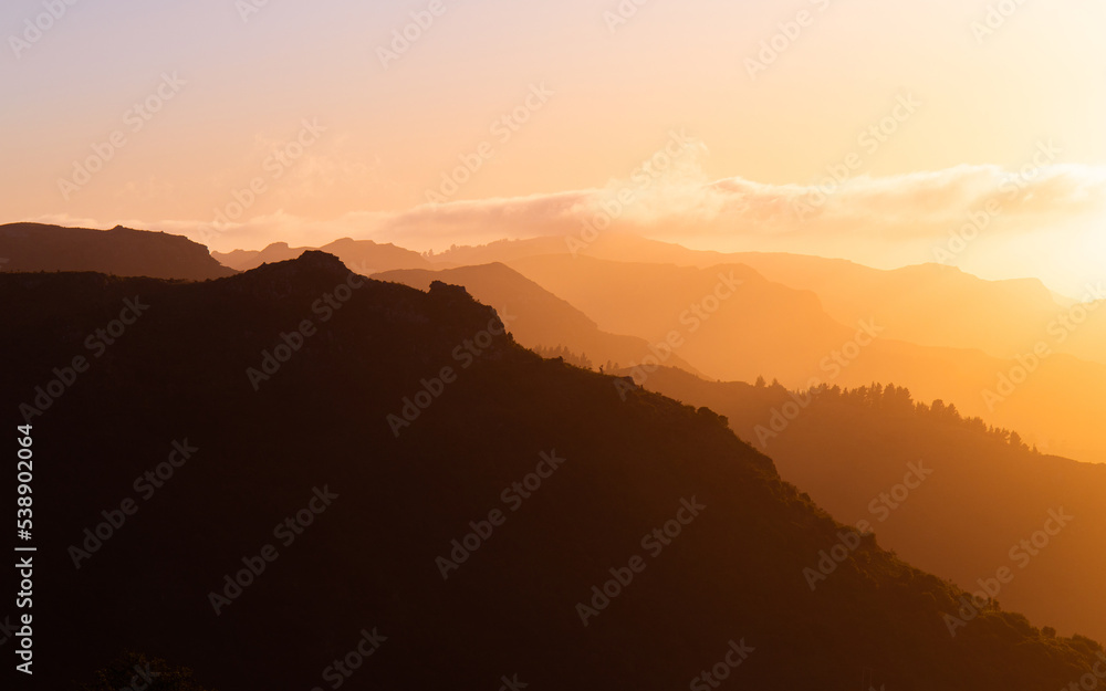 Sunrise view of mountain layers.