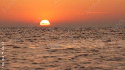 Fototapeta Naklejka Na Ścianę i Meble -  Red big Sun sets over the horizon.