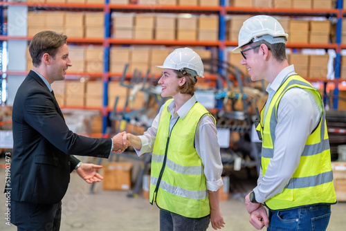 manager visit staff in storage warehouse and have some discussion with site team appreciated and congratulation check hand