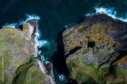 Crawton, Aberdeenshire, Scotland aerial view, bird's eye panorama by drone (sea, cliffs, waves and rocks)