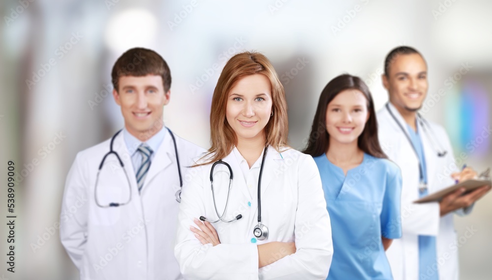Group of medical students posing in the clinic Group of medical students posing in the clinic