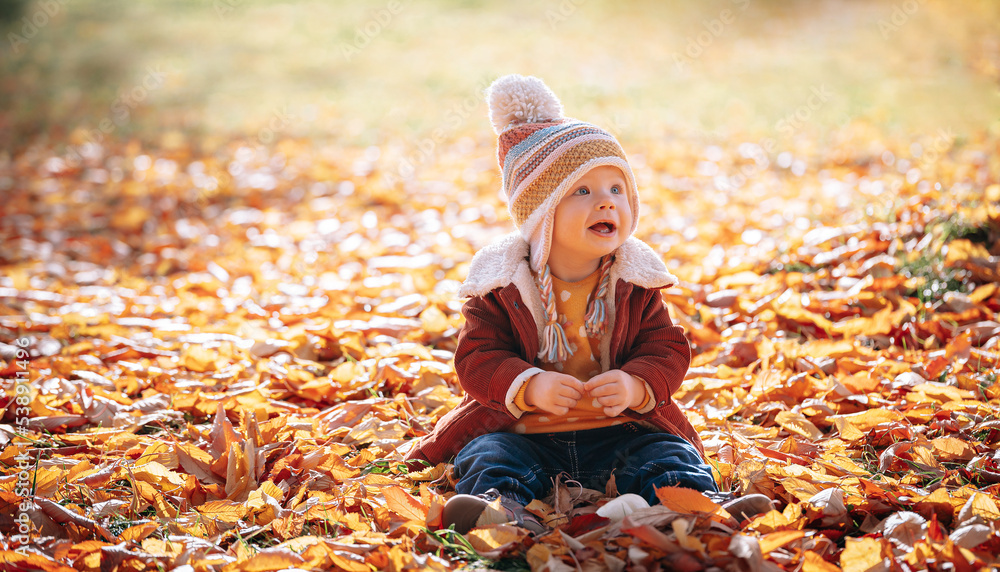 little fashionable and stylish child autumn park