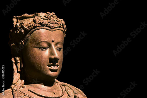 Archaeology ancient buddhist vajrayana and mahayana sculpture art is bodhisattva Avalokitesvara about 1,200 years ago of Srivichaya dynasty. photo