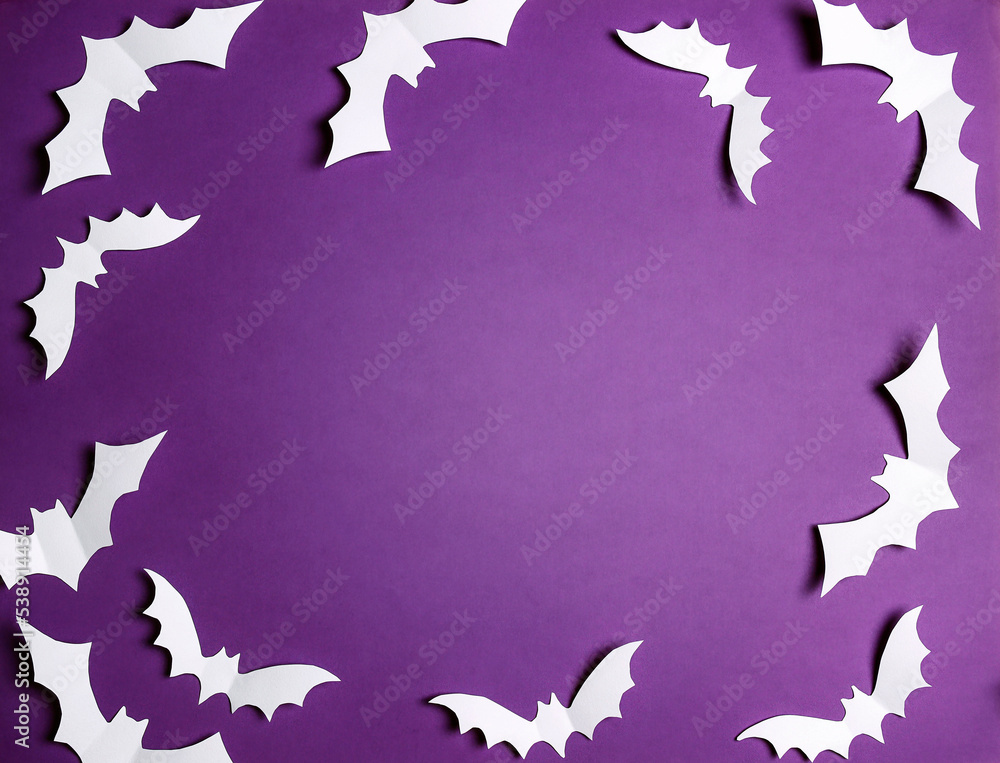 Halloween paper decorations bats on purple background. Halloween paper decorations bats on purple background.