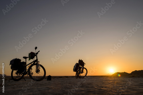 Two Bicycle for travel at an amazing sunrise in the Middle East