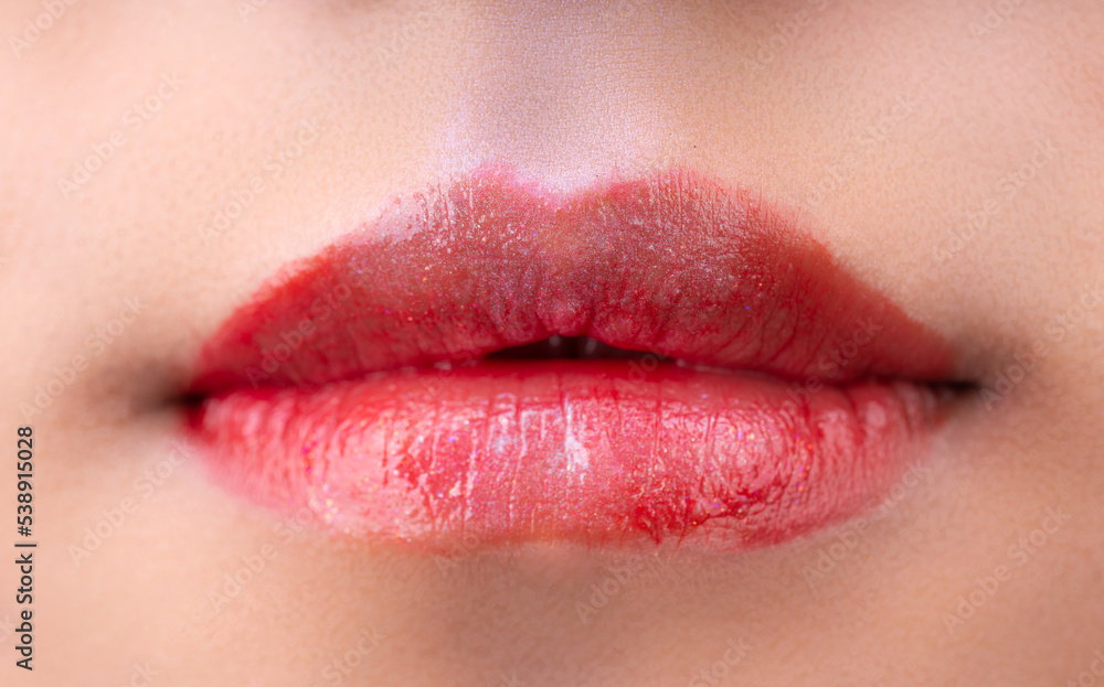 A woman's lips with red lipstick A woman's lips with red lipstick