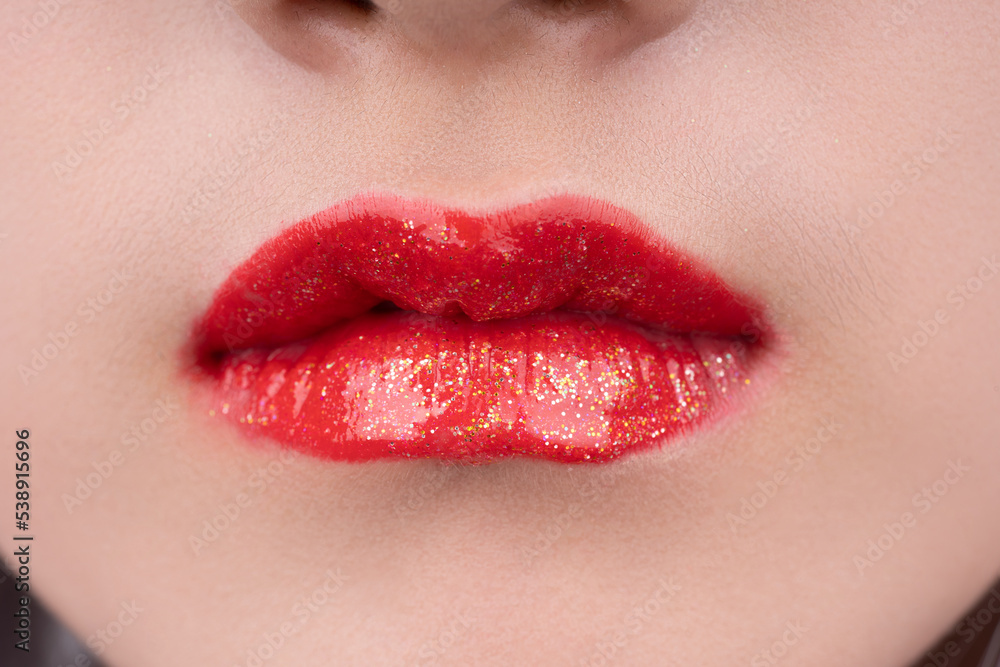 A woman's lips with red lipstick A woman's lips with red lipstick