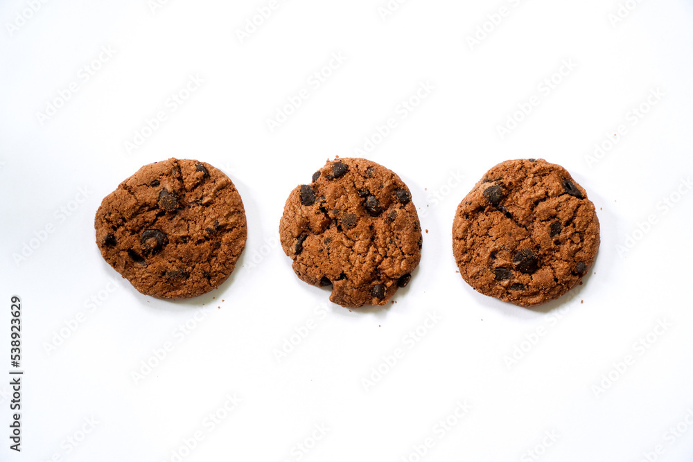 Collection of half chocolate chip cookies on white background.
Collection of half chocolate chip cookies on white background.