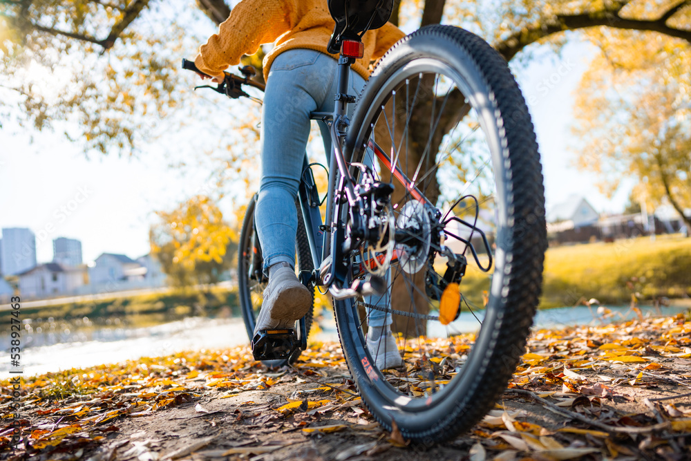 young woman is biking in the nature. young woman is biking in the nature.