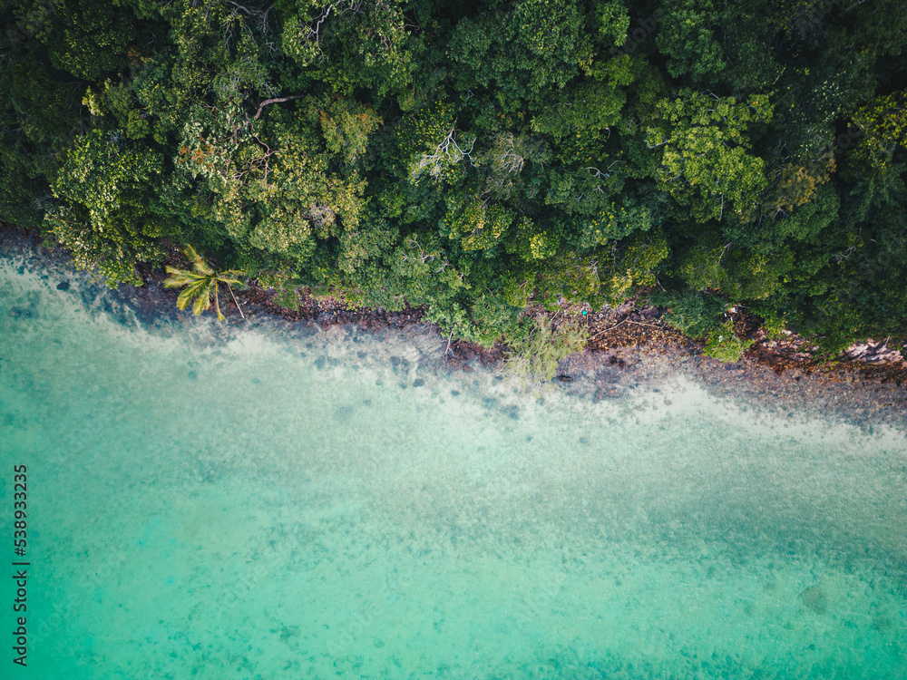 Aerial view sea beach wave with green tree mountain forest in tropical island