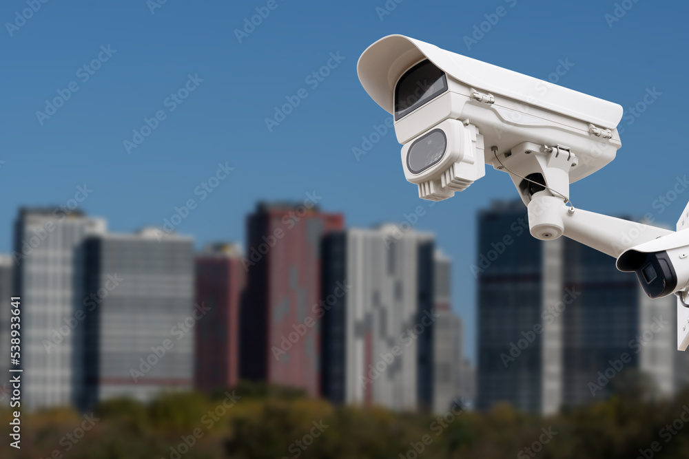 CCTV monitoring, security cameras. Backdrop with views of the city