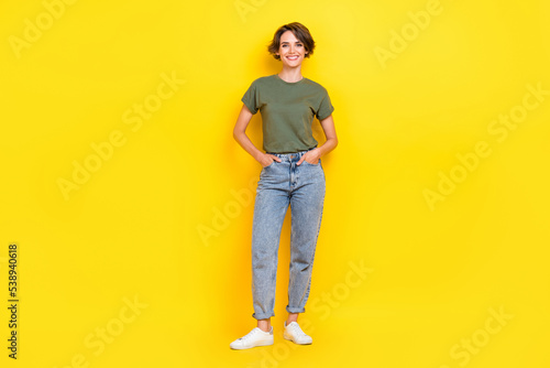 Full length photo of satisfied glad lady dressed nice outfit rejoice buy new collection empty space isolated on yellow color background