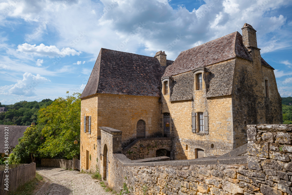 street with old limestone house in the dordogne department street with old limestone house in the dordogne department