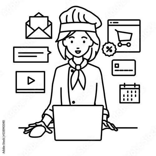 デスクで座ってPCでネットショップやマーケティングの仕事をしている調理師の女性