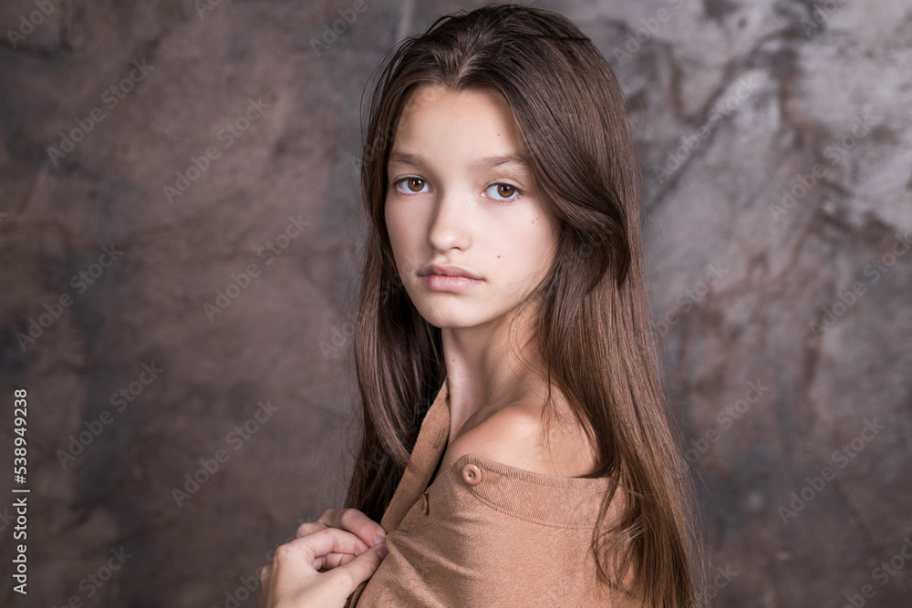 Fototapeta premium Studio portrait of a young teen girl