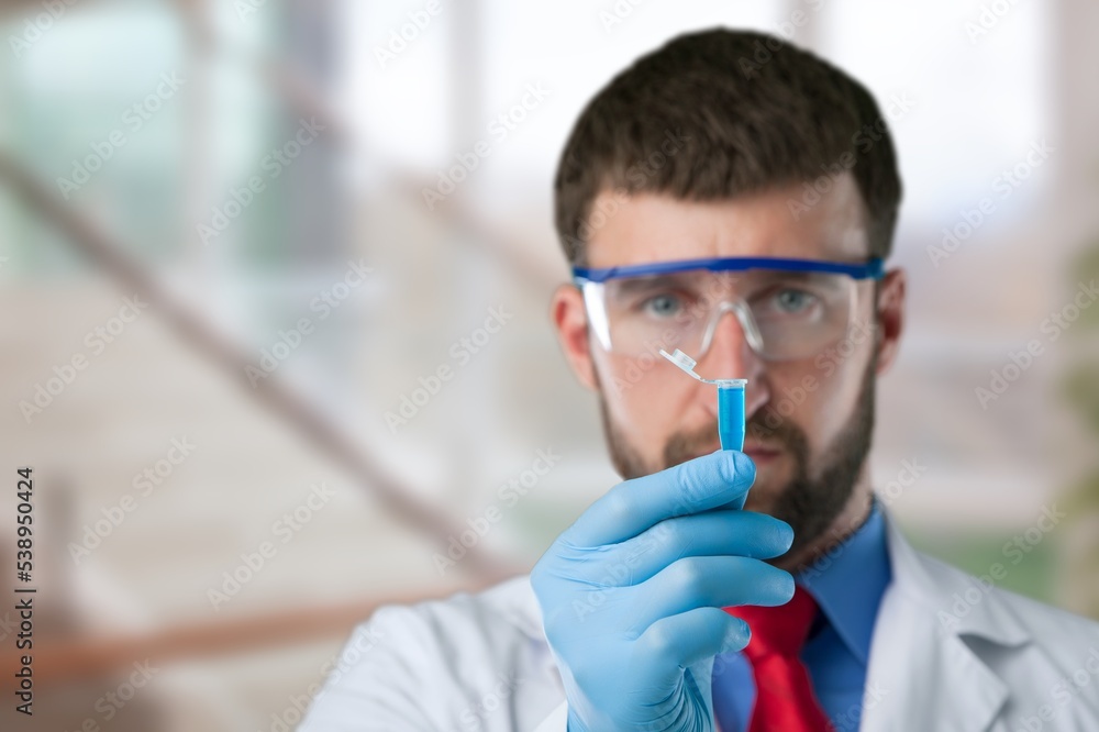 Young scientist work and examine tests in laboratory. Young scientist work and examine tests in laboratory.