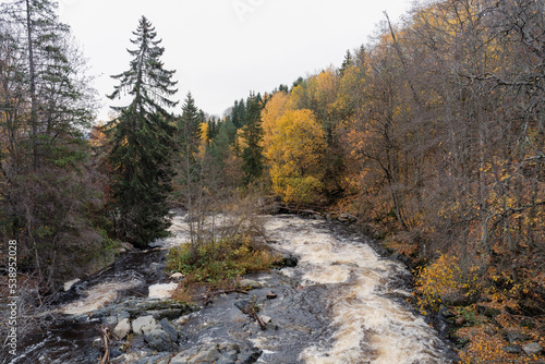 Lenaelva River in fall, seen from the bridge by Kværnum, Toten, Norway.