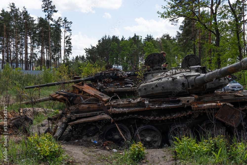 DMITRIVKA, UKRAINE - APRIL 02, 2022: Destroyed tanks and combat vehicles of the Russian occupiers near the village of Dmitrievka, Kyiv region DMITRIVKA, UKRAINE - APRIL 02, 2022: Destroyed tanks and combat vehicles of the Russian occupiers near the village of Dmitrievka, Kyiv region