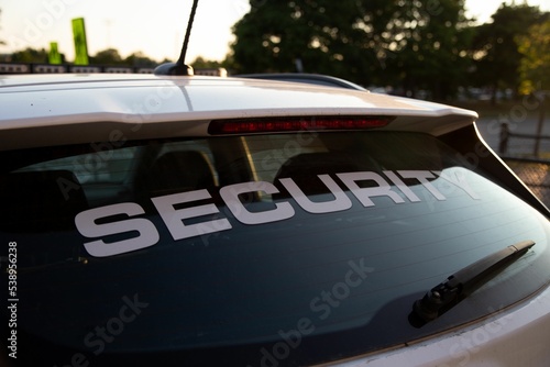 Side view of security patrol car parked outdoors