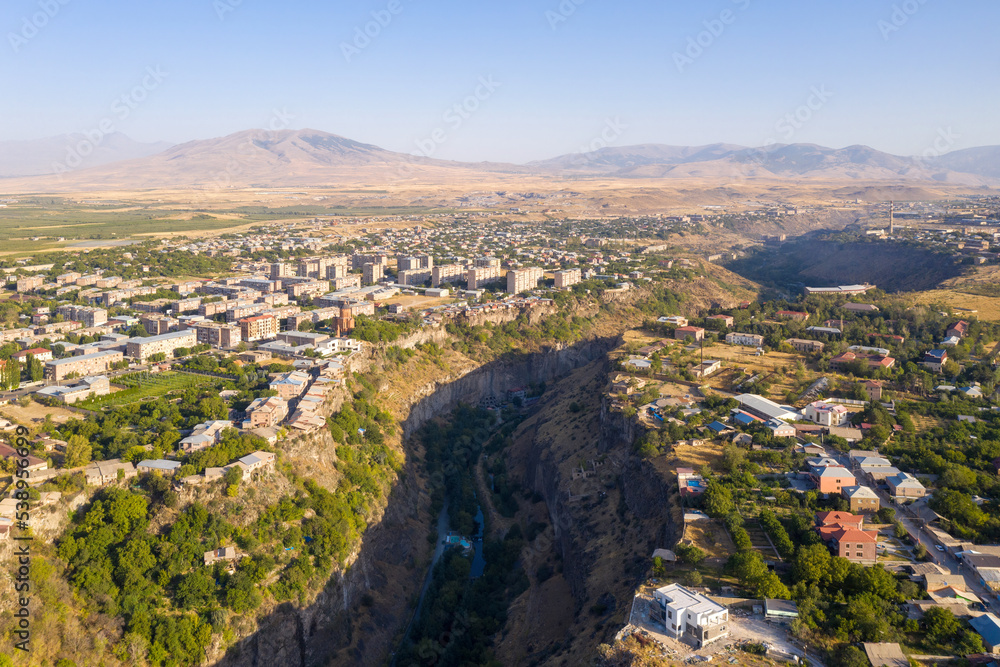 Aerial view of Razdan canyon, Arzni village (right) and Nor Geghi town (left) on sunny summer day. Kotayk Province, Armenia.