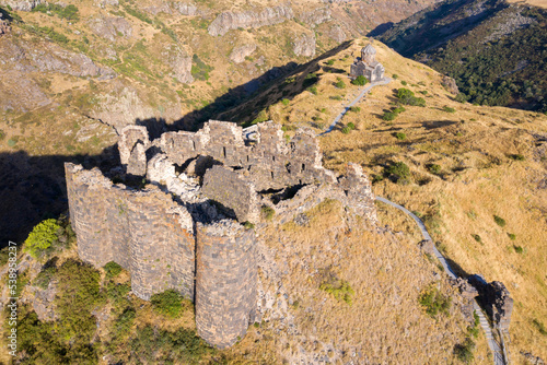 Ruins of Amberd fortress and Vahramashen Church on sunny summer evening. Mount Aragats, Armenia. photo