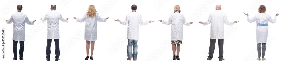 group of doctors standing with their backs isolated group of doctors standing with their backs isolated