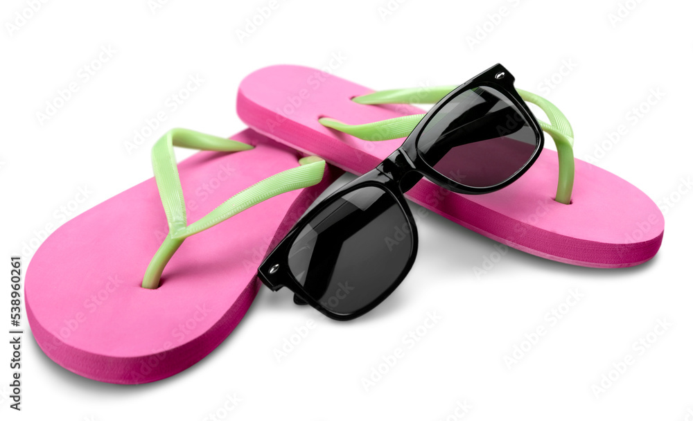 Red flip flops and sunglasses on white