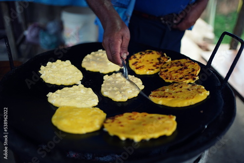 Freshly prepared arepas with cheese on a street stall in Samaipata, Bolivia.  photo