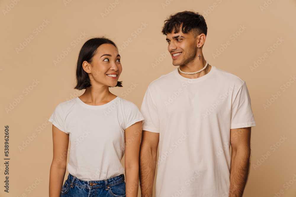 Young beautiful smiling asian woman and stylish handsome smiling man Young beautiful smiling asian woman and stylish handsome smiling man