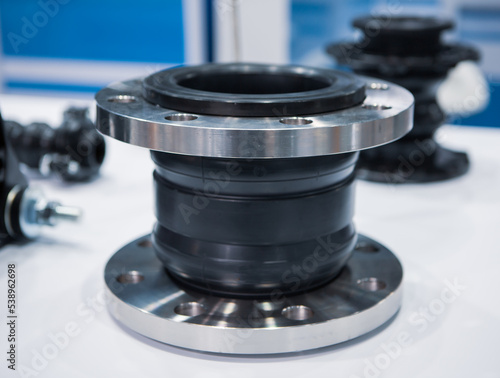 Close-up of industrial process piping parts bellow flexible joint for expansion in piping system