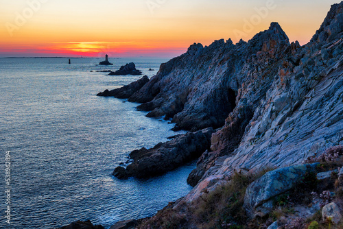 Dusk over Brittany rocky coastline photo