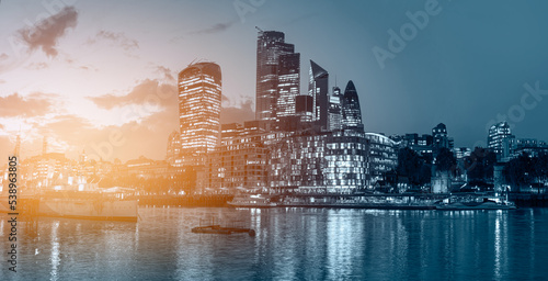 Canvas Print Panorama of the modern skyline on Thames river at twilight blue hour - London, U