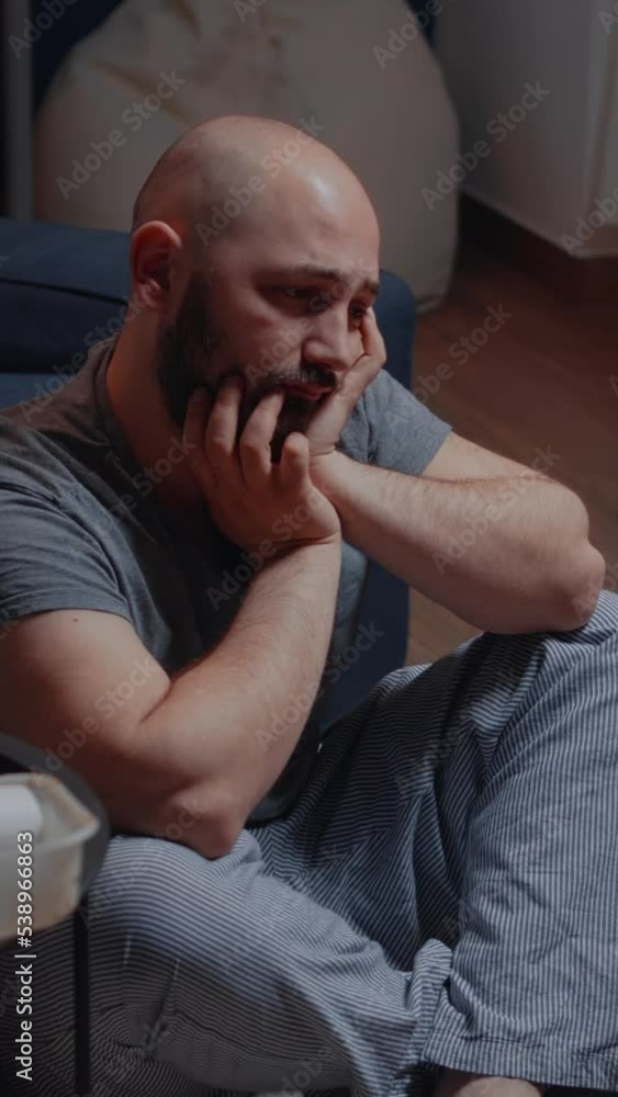 Vertical video: Stressed traumatized tired victim of stress thinking about suicide considering best solve of problems. Adult man feeling disappointment sadness anxiety scared lonely suffering from Vertical video: Stressed traumatized tired victim of stress thinking about suicide considering best solve of problems. Adult man feeling disappointment sadness anxiety scared lonely suffering from