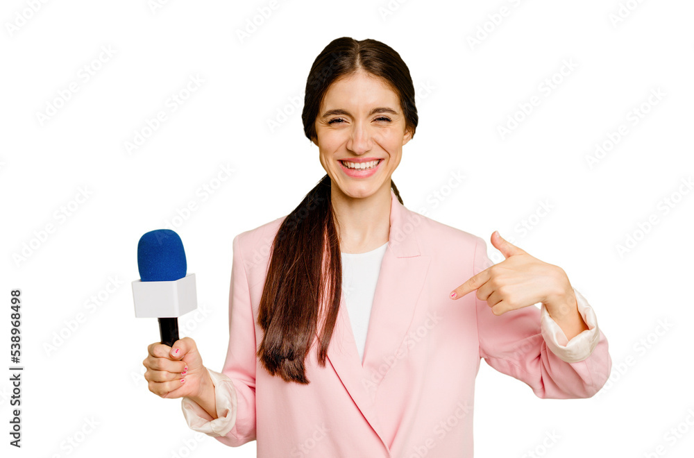 Young TV presenter caucasian woman isolated person pointing by hand to a shirt copy space, proud and confident Young TV presenter caucasian woman isolated person pointing by hand to a shirt copy space, proud and confident