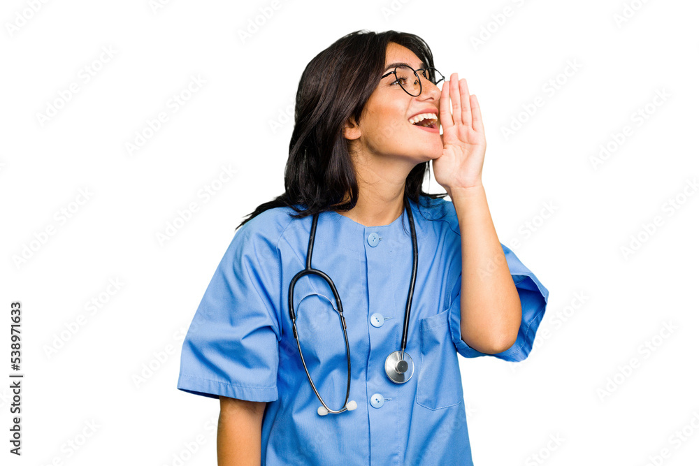 Young nurse Indian woman isolated shouting and holding palm near opened mouth. Young nurse Indian woman isolated shouting and holding palm near opened mouth.