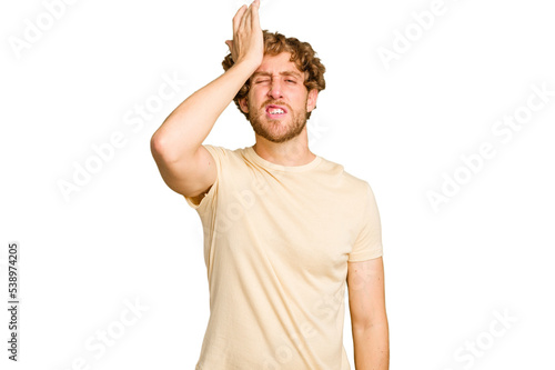 Young caucasian man isolated on green chroma background forgetting something, slapping forehead with palm and closing eyes.