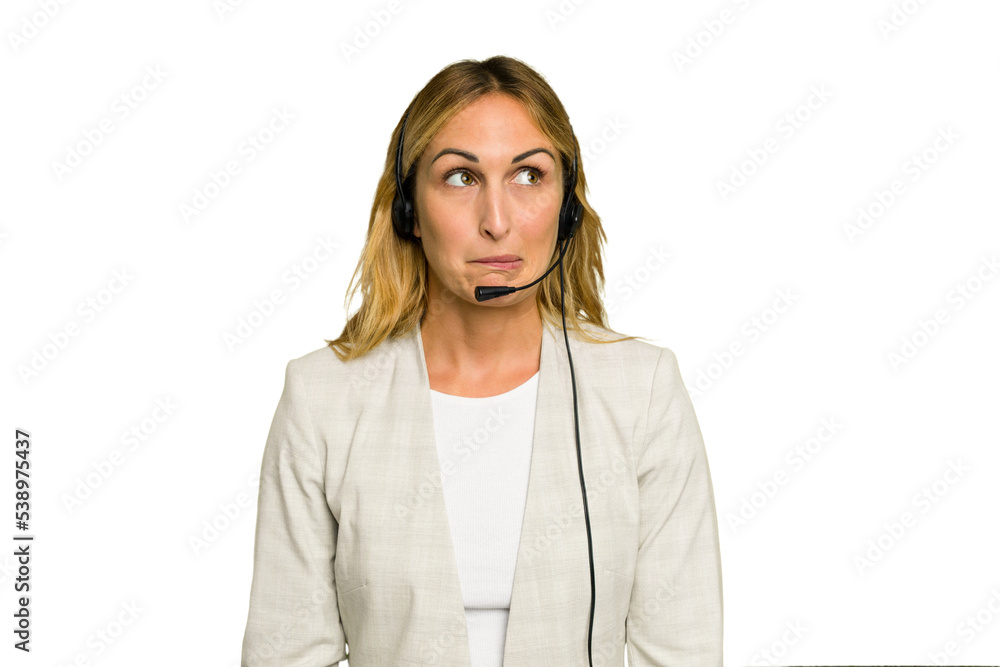 Telemarketer caucasian woman working with a headset isolated on green chroma background confused, feels doubtful and unsure. Telemarketer caucasian woman working with a headset isolated on green chroma background confused, feels doubtful and unsure.
