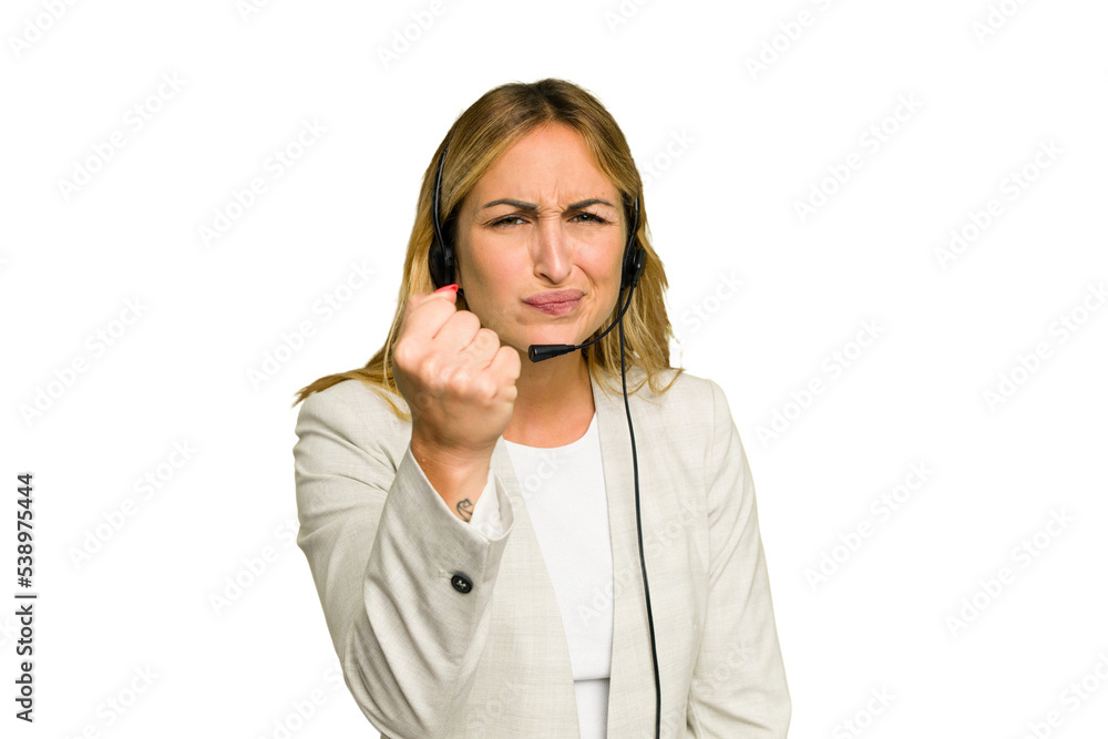 Telemarketer caucasian woman working with a headset isolated on green chroma background showing fist to camera, aggressive facial expression. Telemarketer caucasian woman working with a headset isolated on green chroma background showing fist to camera, aggressive facial expression.