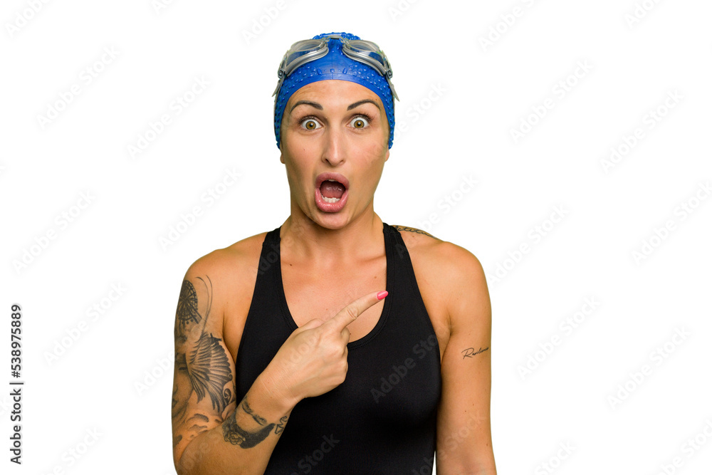 Young caucasian swimmer woman isolated on green chroma background pointing to the side Young caucasian swimmer woman isolated on green chroma background pointing to the side
