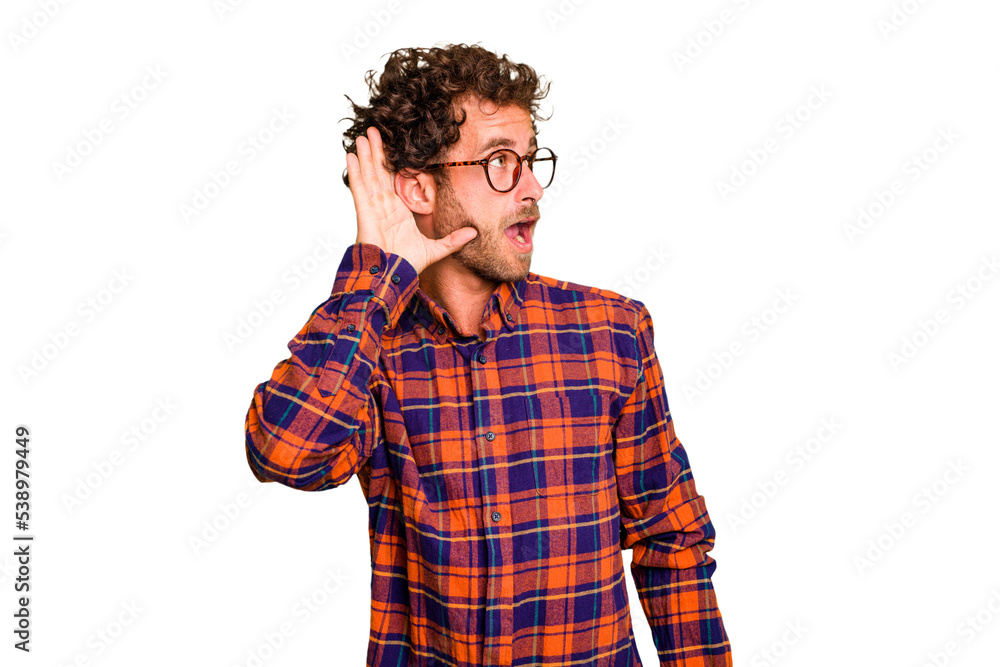 Young caucasian curly hair man isolated Young caucasian man with curly hair isolated trying to listening a gossip. Young caucasian curly hair man isolated Young caucasian man with curly hair isolated trying to listening a gossip.